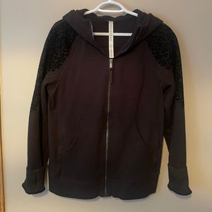 Black Lululemon hoodie with velvet embellishment on the sleeves.